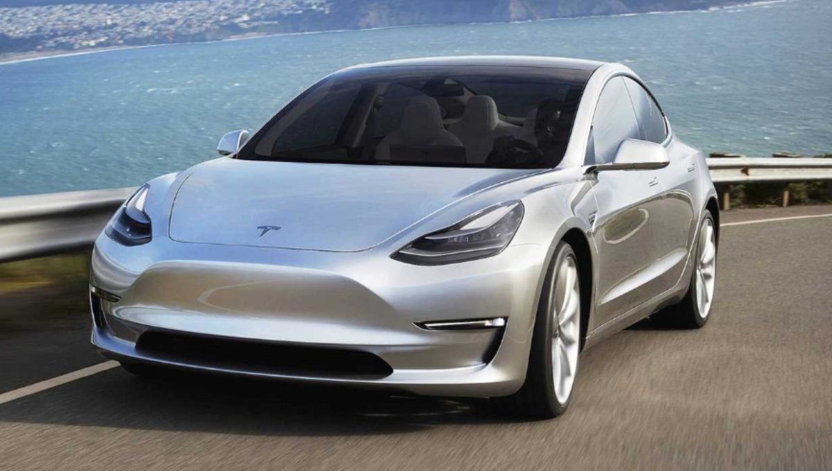 2025 Tesla Model 3 Performance and Long Range parked side by side at sunset