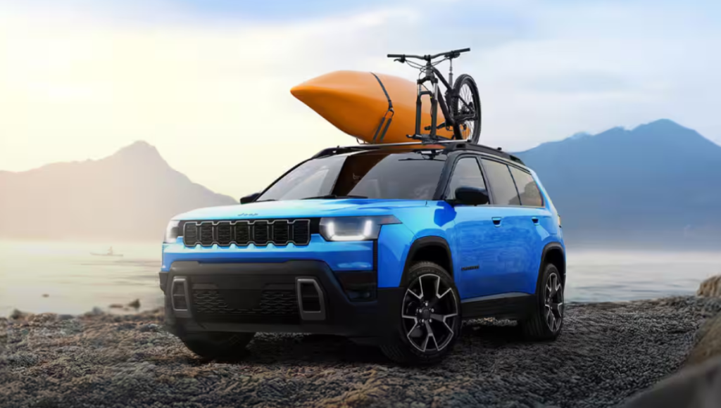 2026 Jeep Cherokee hybrid in a desert overlook with a boxy profile and roof rails