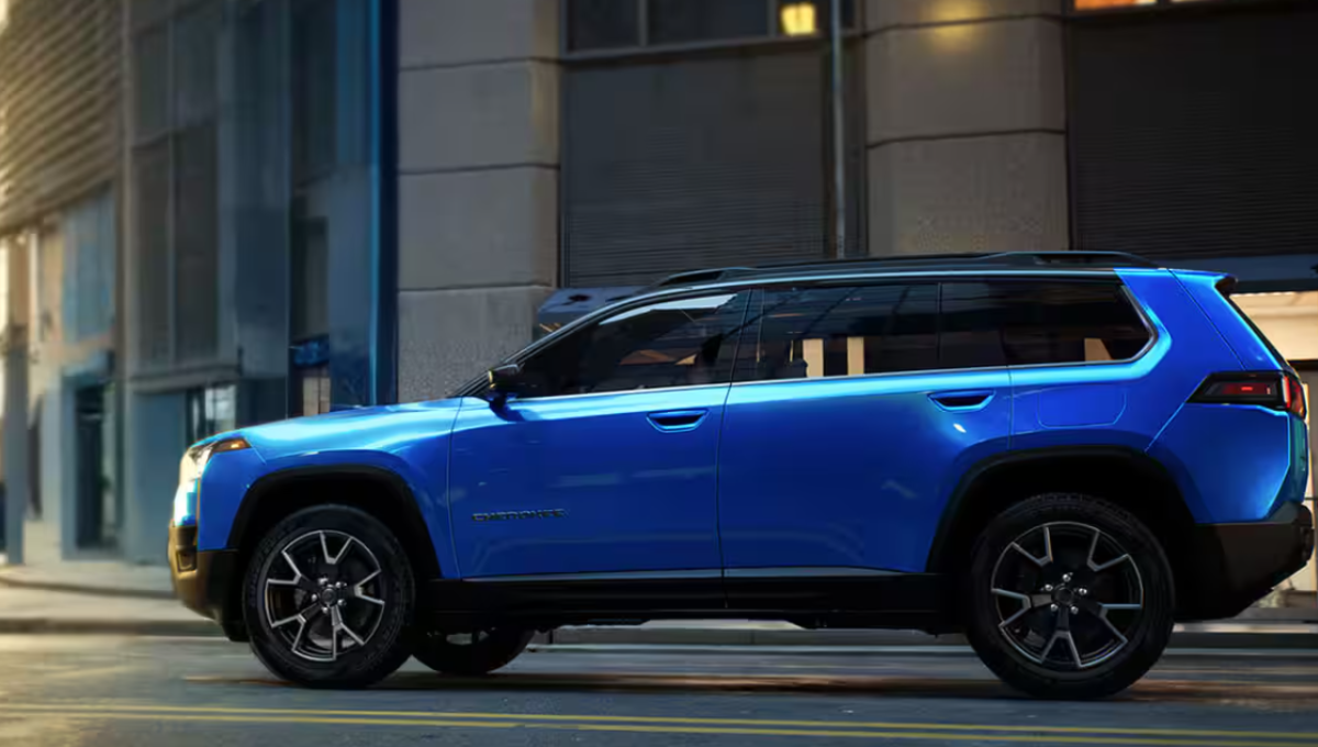 2026 Jeep Cherokee hybrid in a desert overlook with a boxy profile and roof rails