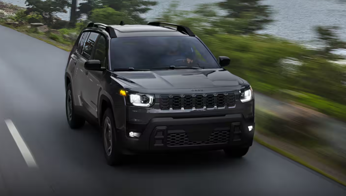 2026 Jeep Cherokee hybrid in a desert overlook with a boxy profile and roof rails