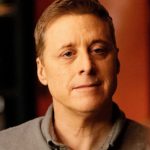 Alan Tudyk voicing Cosmo Bot at press event in 2025