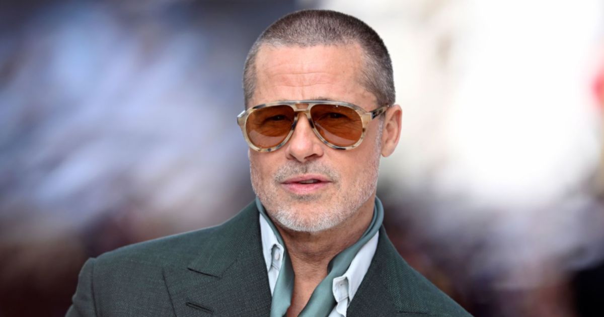 Brad Pitt on the red carpet in 2025, backdrop with his name