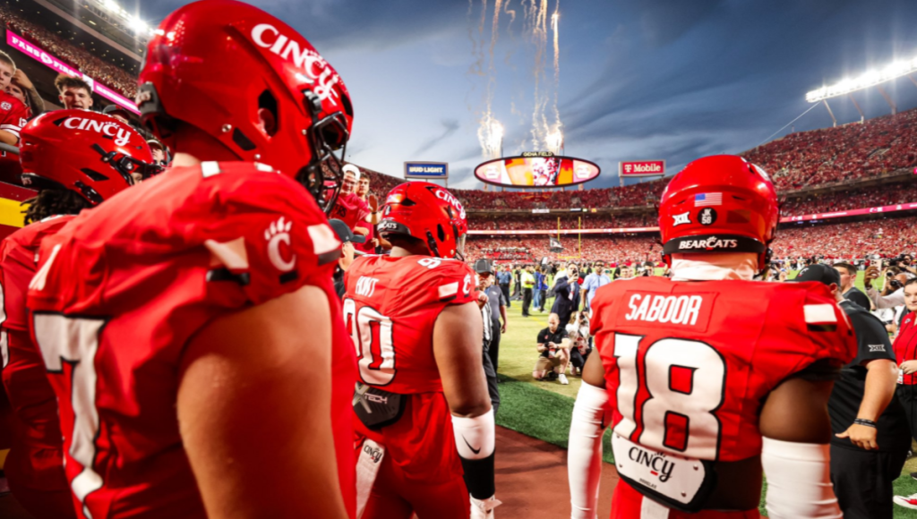 Cincinnati Bearcats football team at Nippert Stadium during a night game, 2025