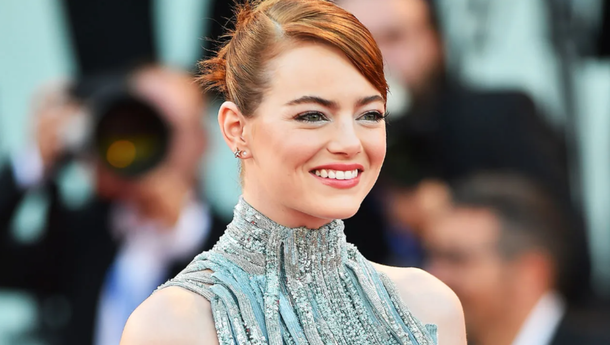 Emma Stone and Willem Dafoe greet on the red carpet at the Venice Bugonia world premiere