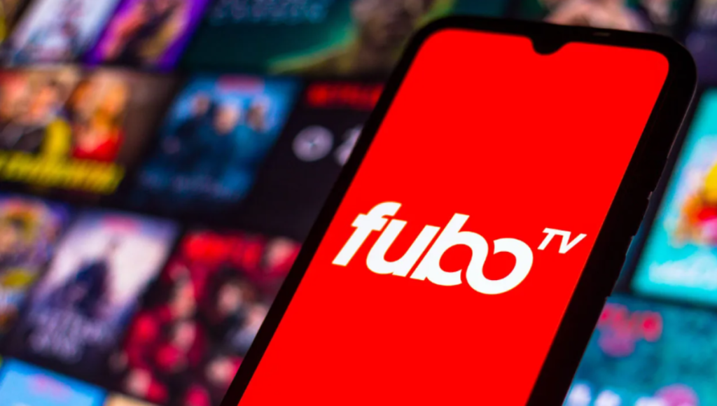 FuboTV app shown on a living room TV with sports tiles and a remote in hand