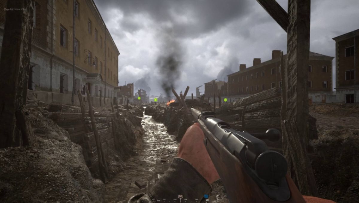 Hell Let Loose soldiers advancing through ruined Stalingrad with tank support at dusk