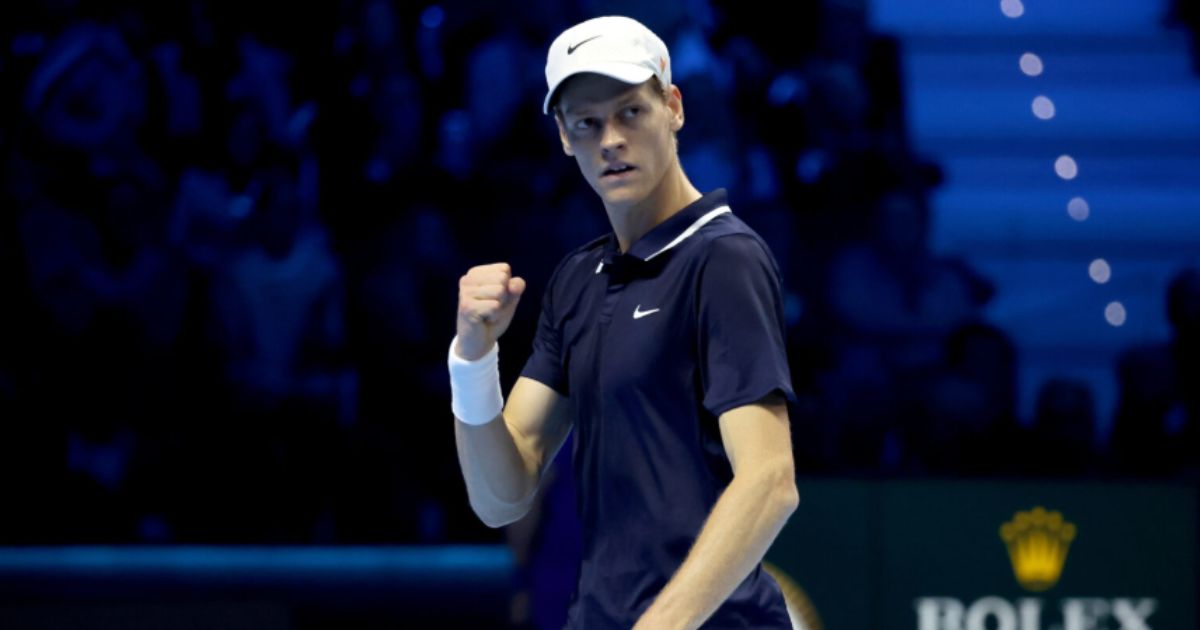 Jannik Sinner celebrating his 2025 Wimbledon win, lifting the Norman Brookes Challenge Cup on Centre Court