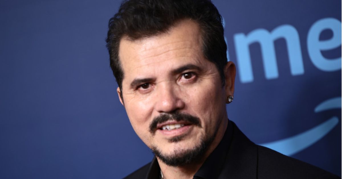 John Leguizamo speaking at a cultural event in 2025