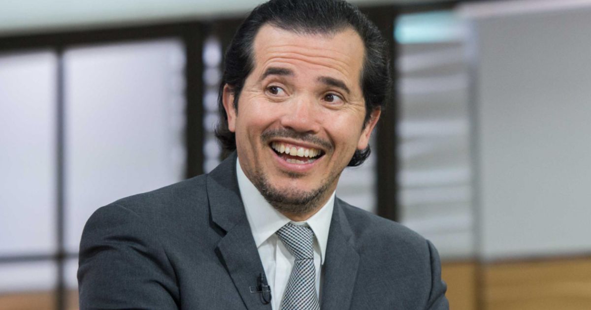 John Leguizamo speaking at a cultural event in 2025
