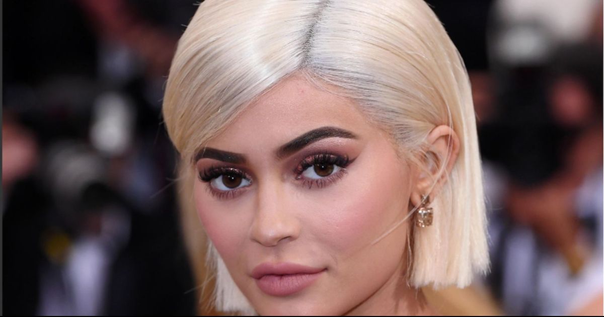 Kylie Jenner posing in a high-fashion outfit during her 28th birthday celebrations