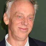 Mike White speaking on a TV panel in 2025