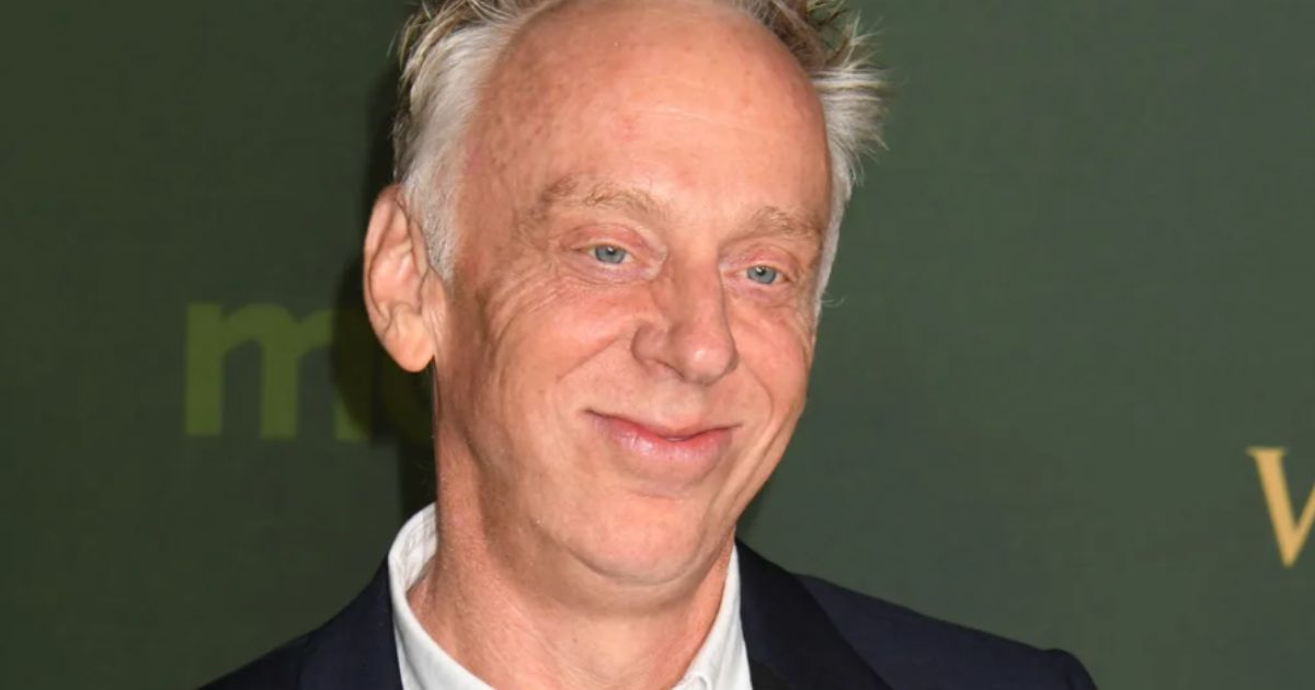 Mike White speaking on a TV panel in 2025