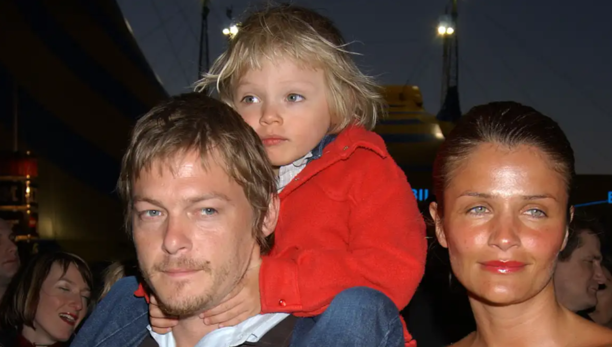 Mingus Lucien Reedus at a runway backstage area with cameras and lights