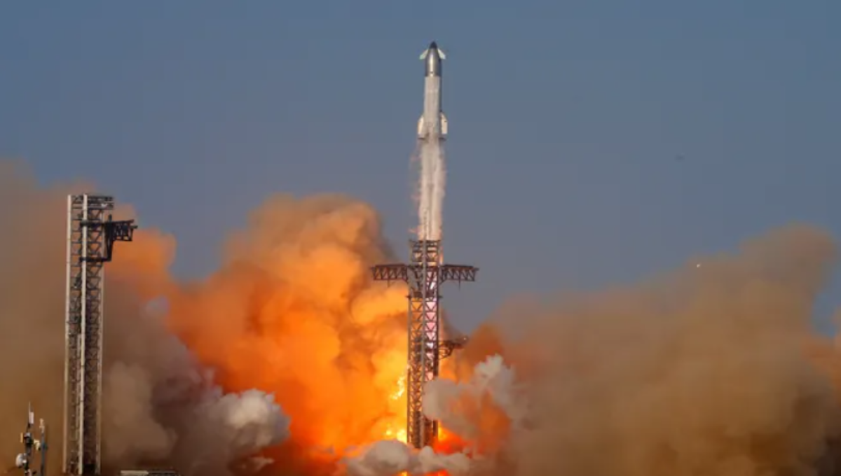 SpaceX Starship stacked on Super Heavy at Starbase at golden hour with vapor clouds