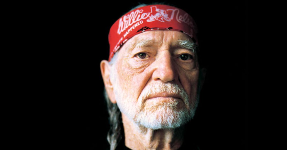 Willie Nelson performing live on stage with guitar Trigger during the Outlaw Music Festival 2025