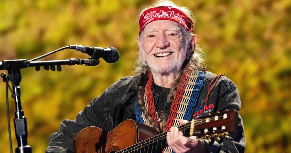 Willie Nelson performing live on stage with guitar Trigger during the Outlaw Music Festival 2025