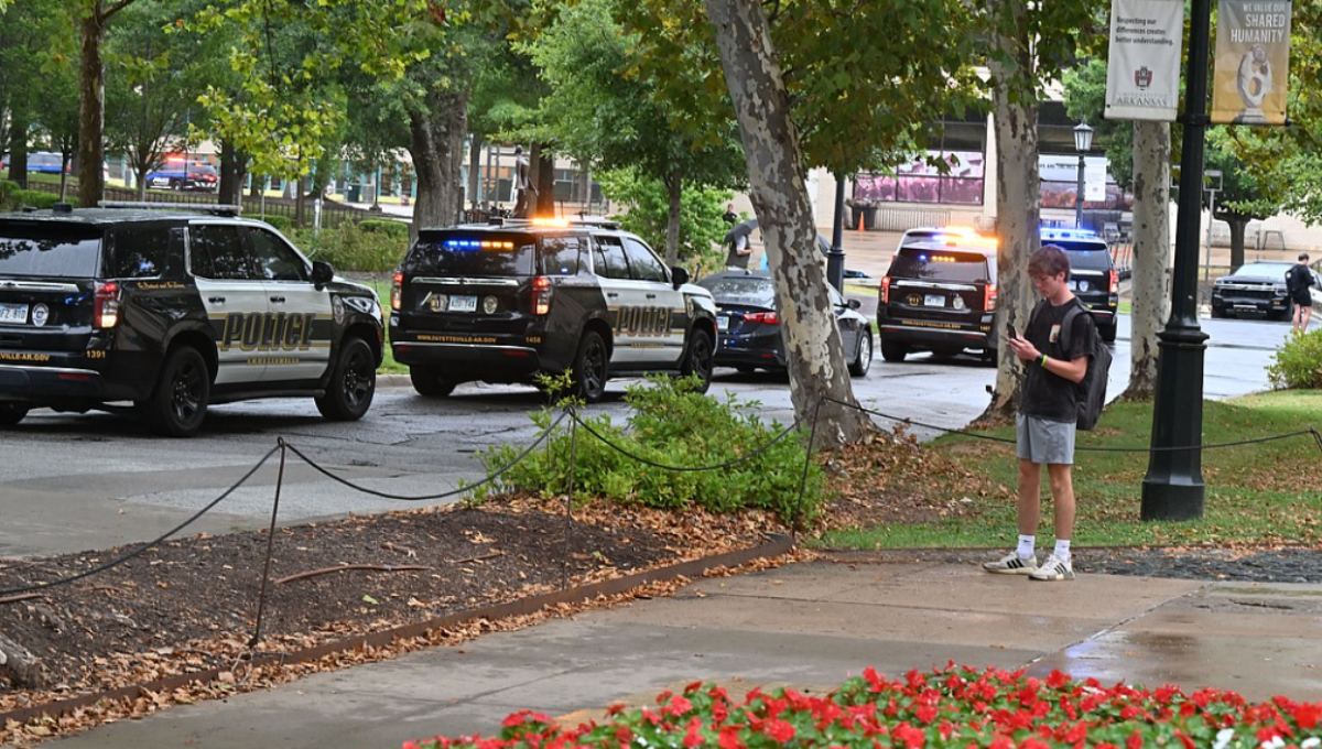 Police lights outside Mullins Library at the University of Arkansas after an active shooter alert