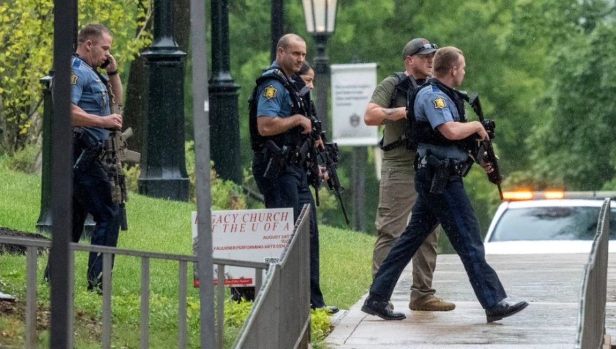 Police lights outside Mullins Library at the University of Arkansas after an active shooter alert