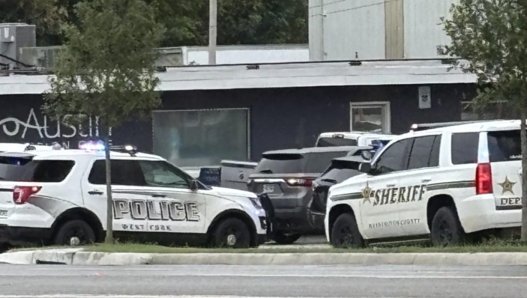 Police lights outside Mullins Library at the University of Arkansas after an active shooter alert