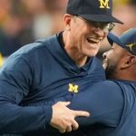 University of Michigan Wolverines football baring the NCAA logo with a gavel and penalty icons in the background