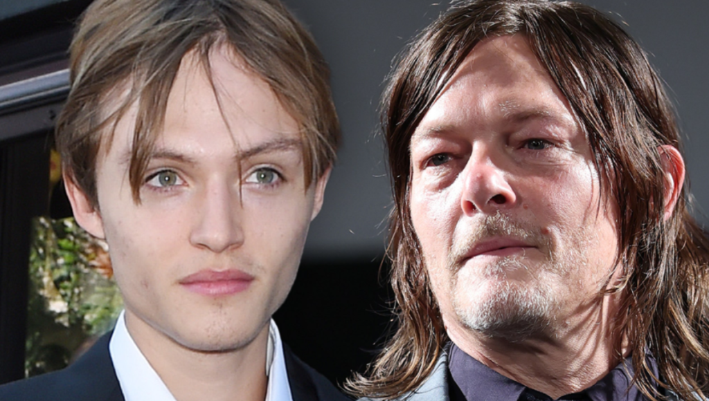 Mingus Lucien Reedus at a runway backstage area with cameras and lights