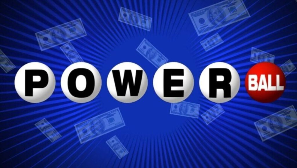 Powerball lottery balls tumbling inside the draw machine with the clock showing 10:59 p.m. ET
