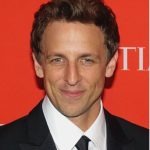 Seth Meyers performing behind his desk on Late Night, smiling in 2025