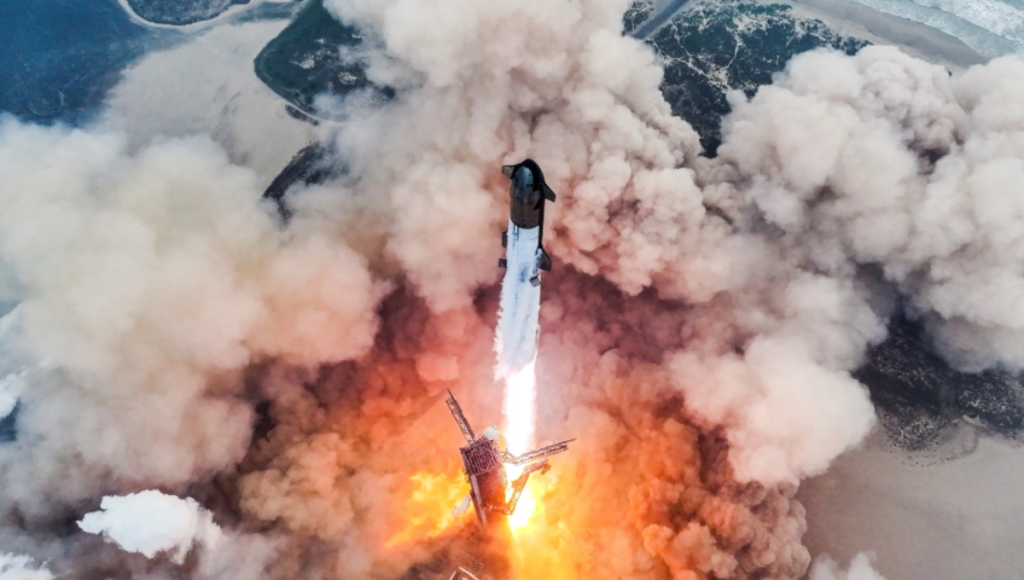 Falcon 9 lifting off at dusk with contrail and illuminated plume