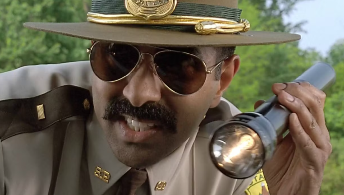 A set photo concept of highway patrol sunglasses and a mustache comb on a script marked “Winter Soldiers”