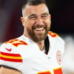 Travis Kelce posing in a fur-lined hood for his GQ cover shoot, September 2025
