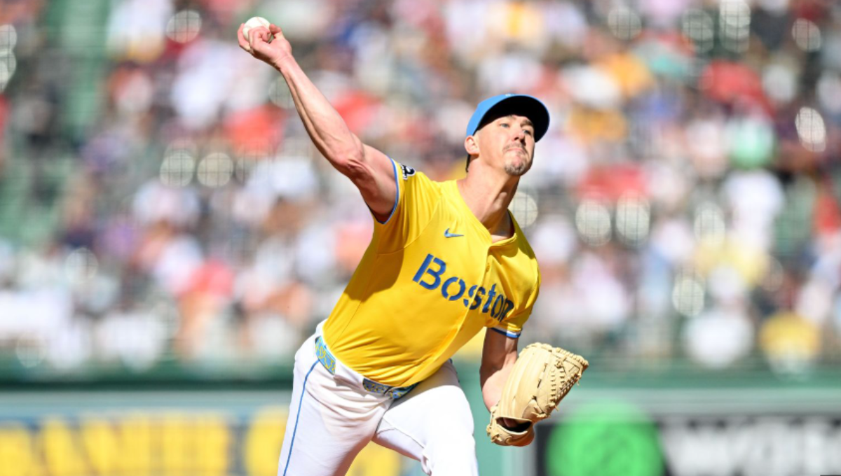 Walker Buehler in a Red Sox uniform walking off the mound at Fenway Park