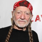 Willie Nelson performing live on stage with guitar Trigger during the Outlaw Music Festival 2025