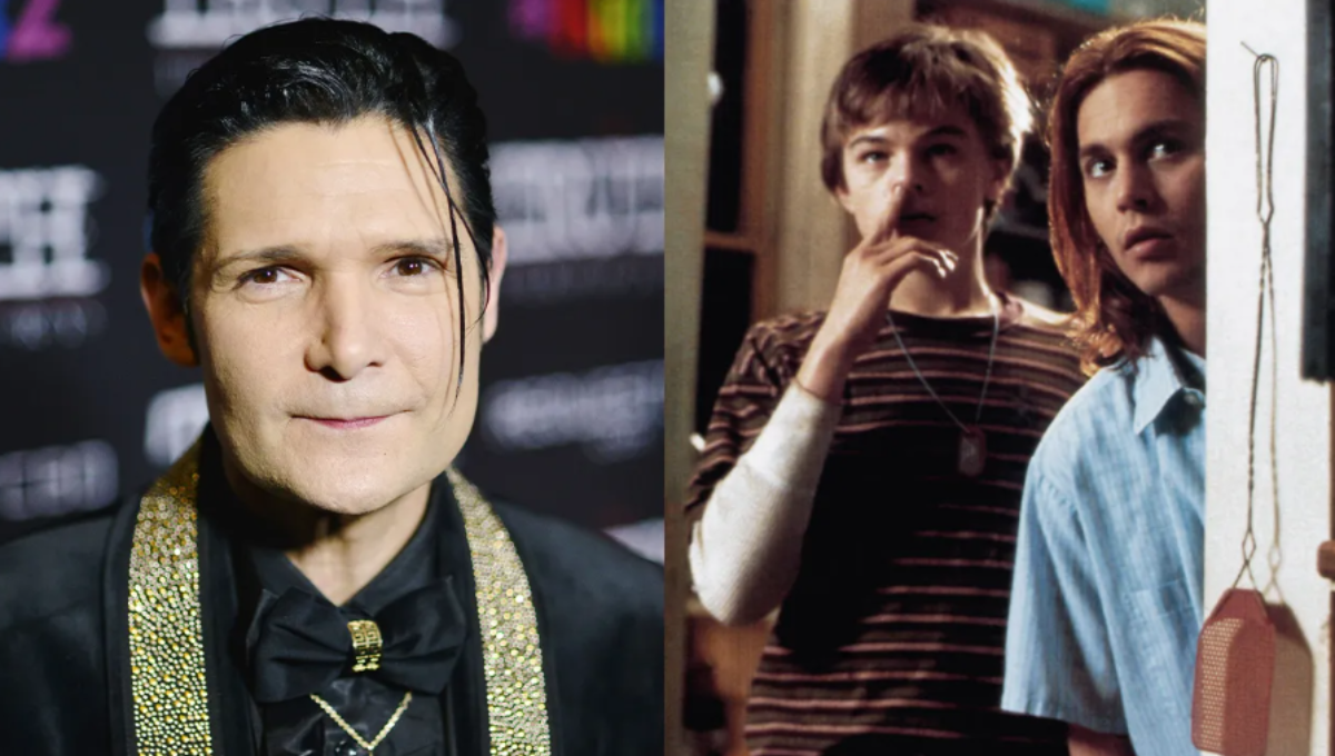 Corey Feldman performing on stage with spotlight and microphone