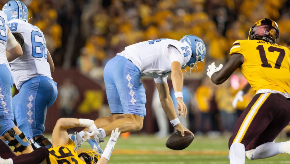 Max Johnson celebrating a touchdown pass after returning from injury in a UNC uniform