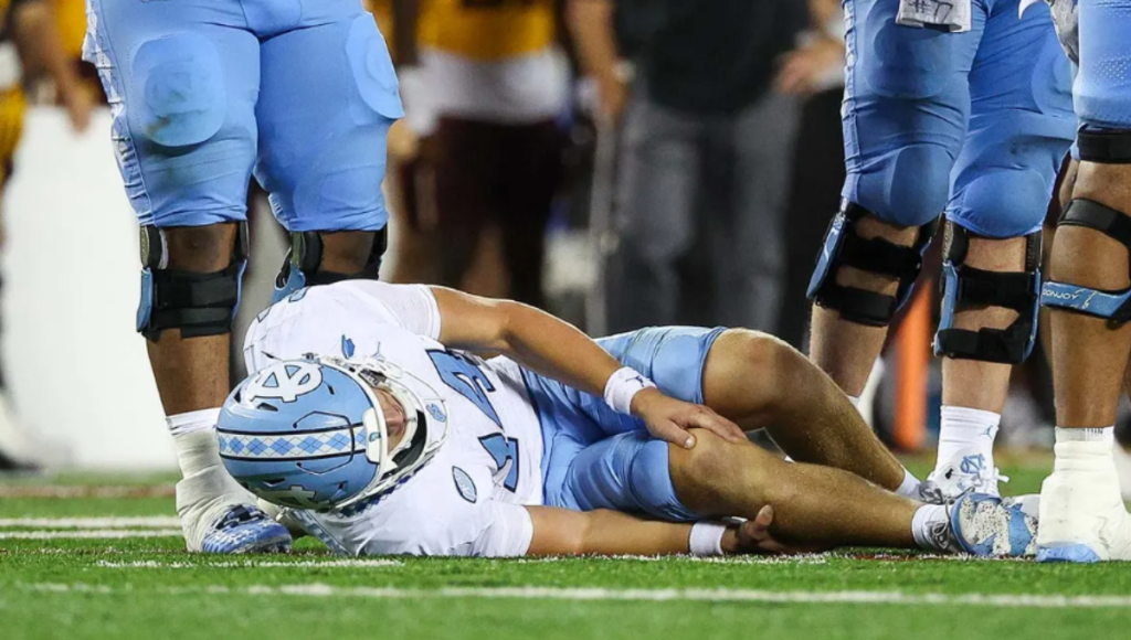 Max Johnson celebrating a touchdown pass after returning from injury in a UNC uniform