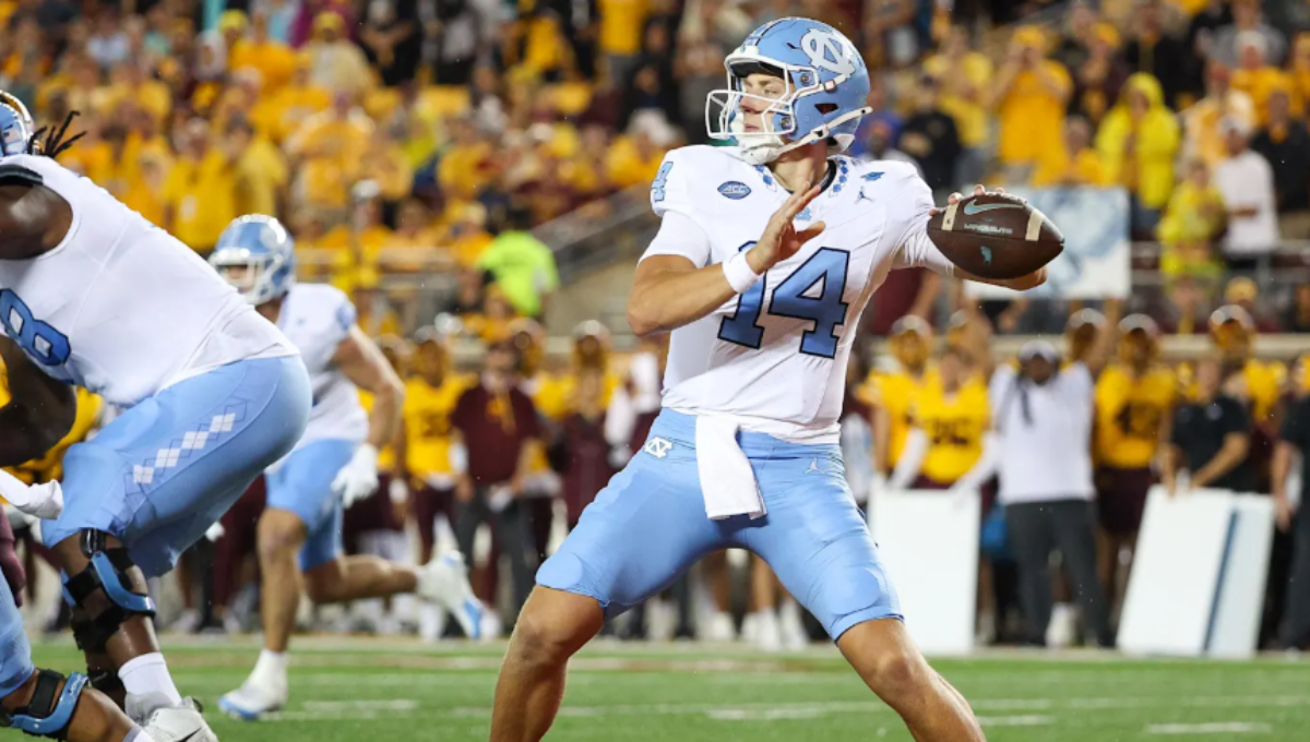 Max Johnson celebrating a touchdown pass after returning from injury in a UNC uniform