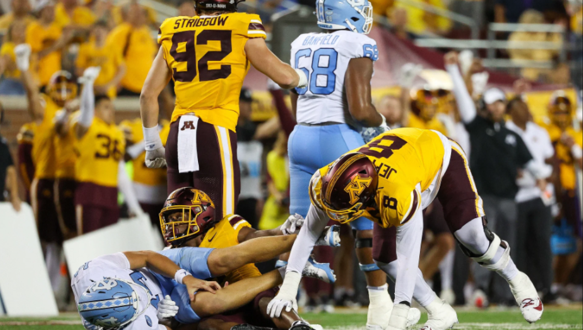 Max Johnson celebrating a touchdown pass after returning from injury in a UNC uniform