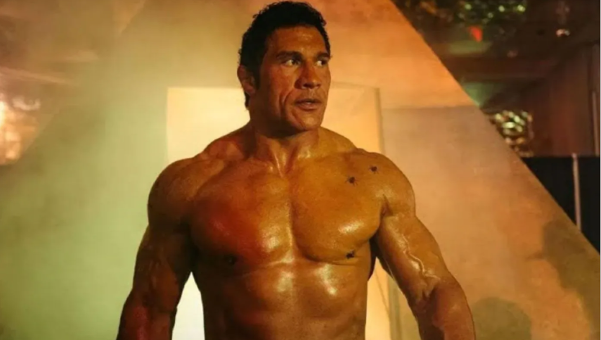 Dwayne Johnson as Mark Kerr in a dimly lit locker room, hands taped, preparing to fight
Tags: Smashing Machine, Dwayne Johnson, Emily Blunt, Mark Kerr, A24, Venice Film Festival, MMA