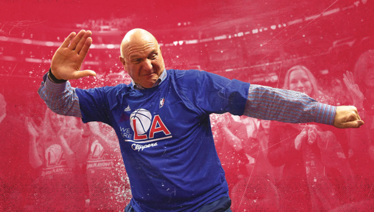 Steve Ballmer smiling courtside at Intuit Dome with fans in the background