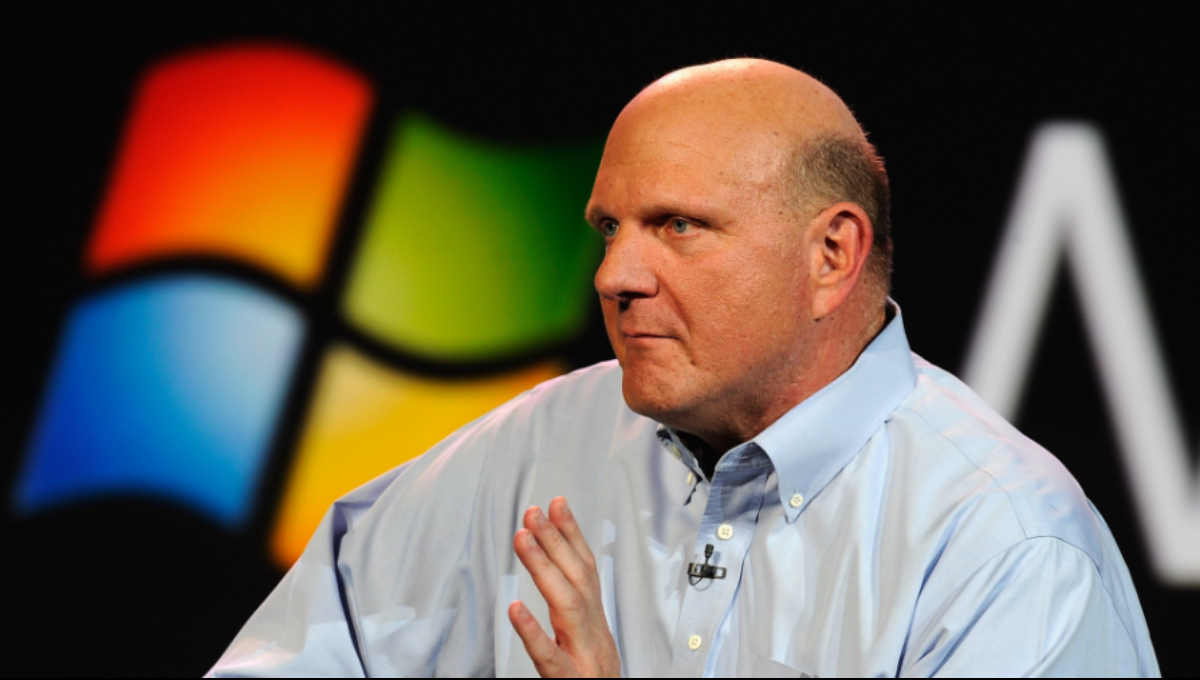 Steve Ballmer smiling courtside at Intuit Dome with fans in the background