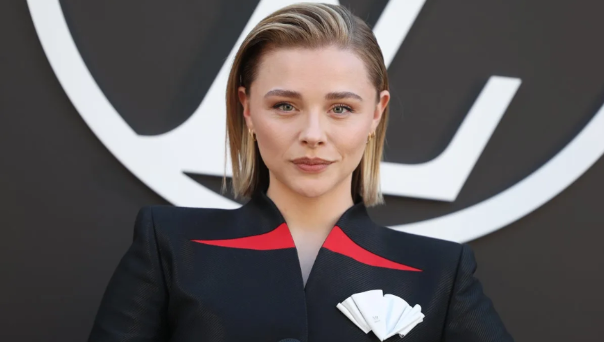 Kate Harrison in a custom Louis Vuitton bridal look, smiling beside Chloë Grace Moretz after their ceremony