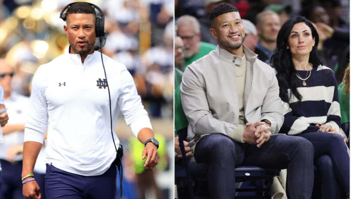 Marcus Freeman on the Notre Dame sideline addressing players during a timeout