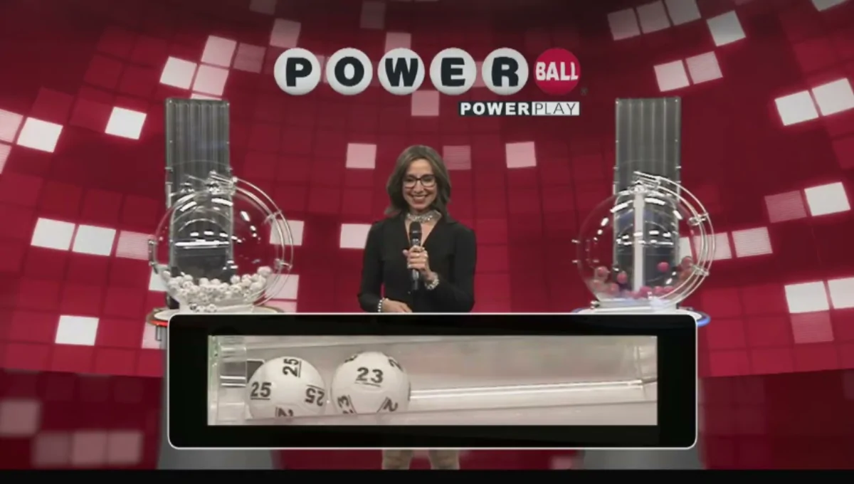 Powerball play slip and red lottery ball with a calendar showing the next draw date